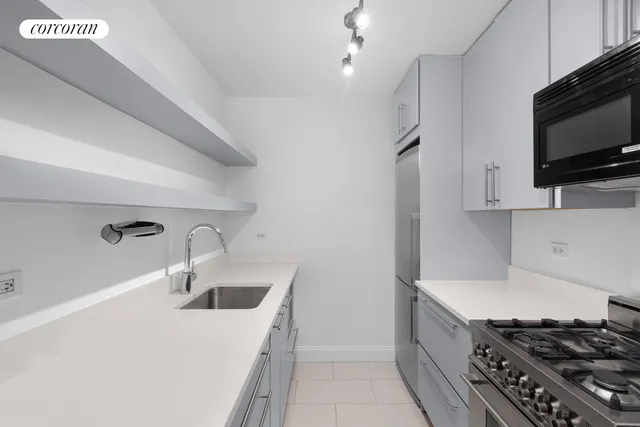 a living room with furniture fireplace and wooden floor