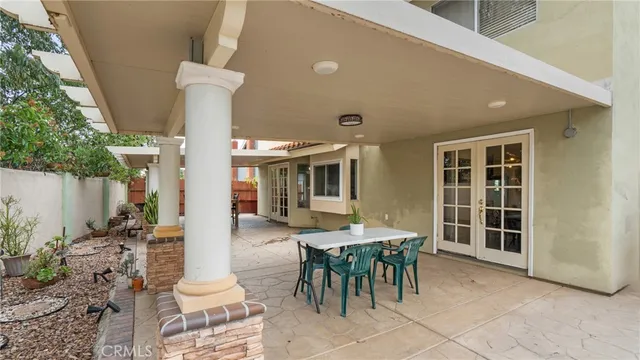 a front view of a house with outdoor seating
