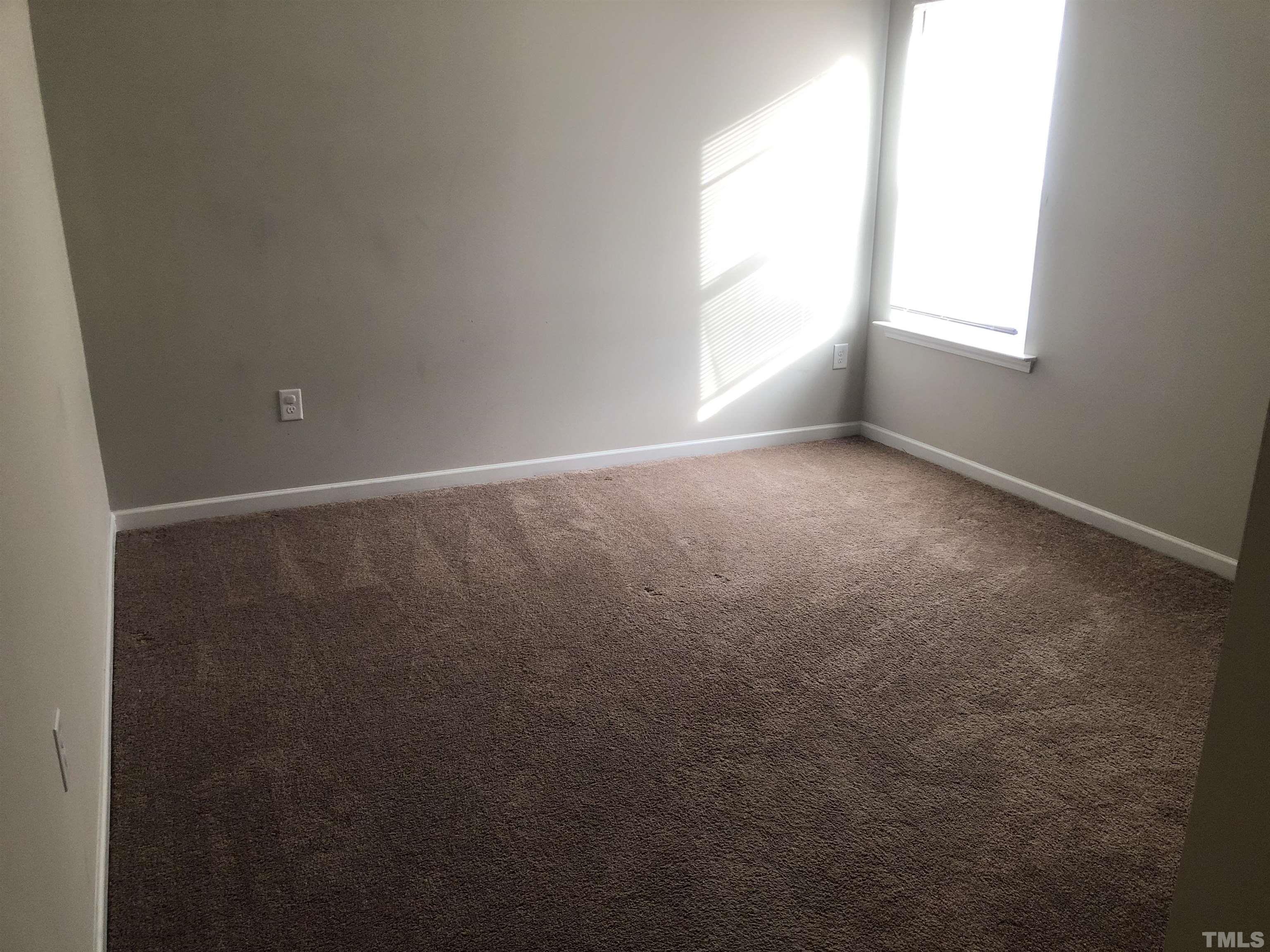 6830 Resting Grove Road Raleigh, NC 27610 - Photo 9 of 20 a view of an empty room with a window