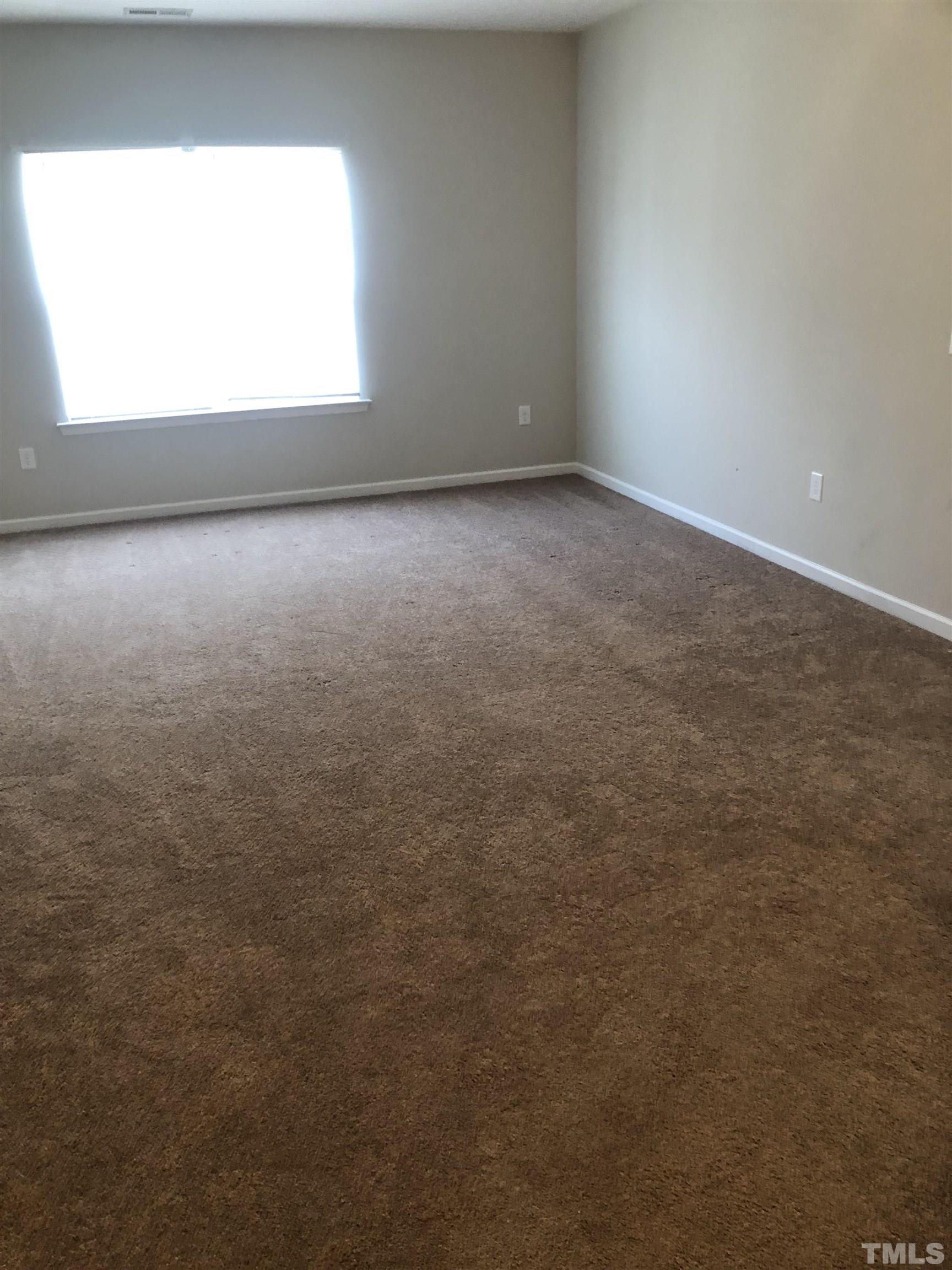 6830 Resting Grove Road Raleigh, NC 27610 - Photo 10 of 20 a view of an empty room and a window