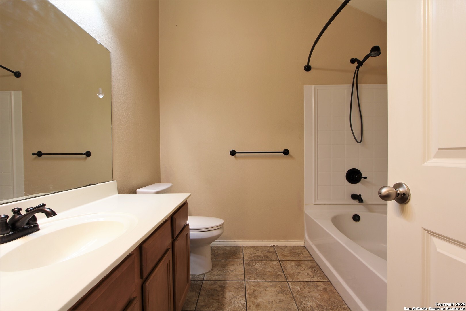 11118 Geneva Sound San Antonio, TX 78254 - Photo 13 of 15 a bathroom with a sink a toilet and shower
