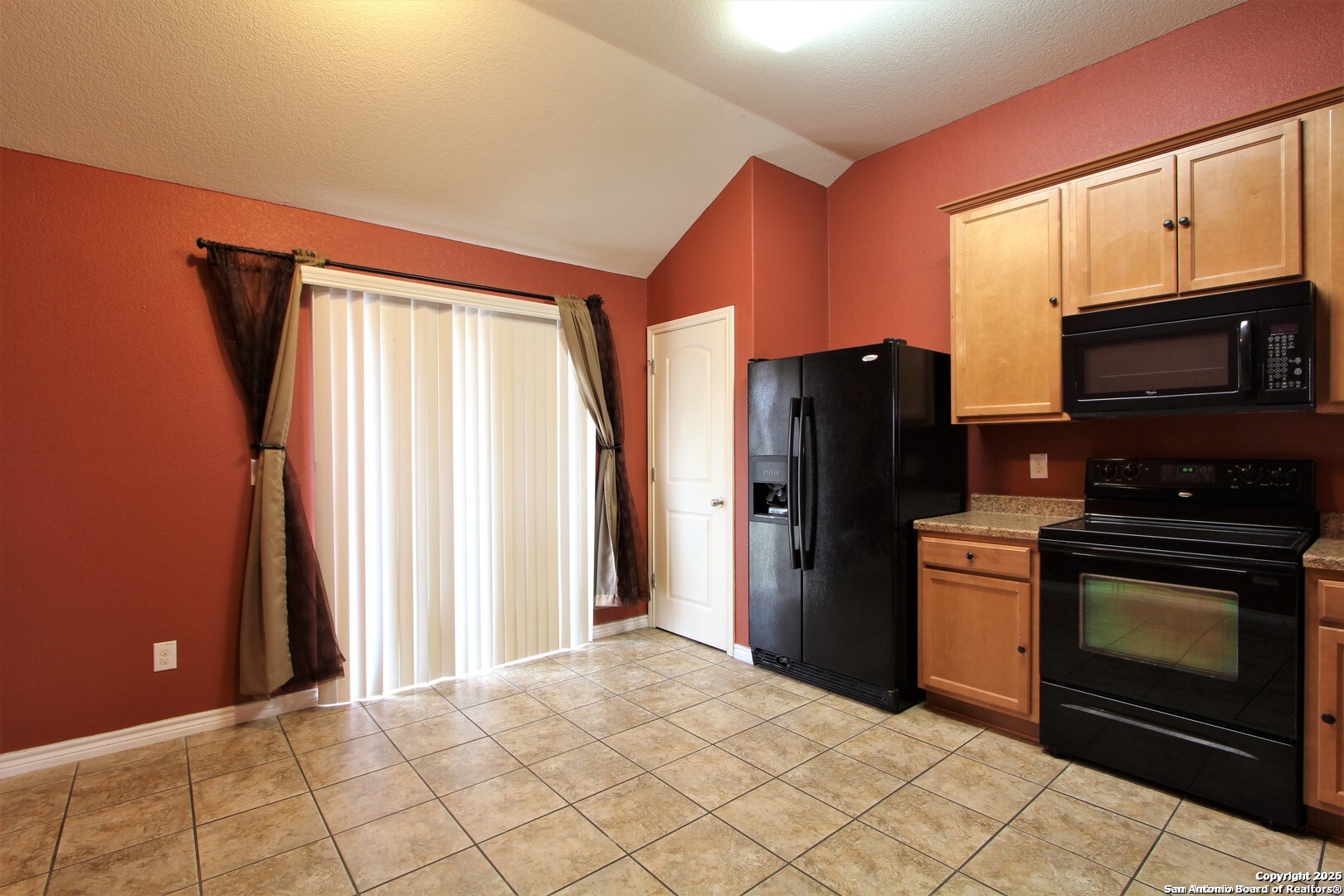 11118 Geneva Sound San Antonio, TX 78254 - Photo 5 of 15 a kitchen with stainless steel appliances granite countertop a refrigerator stove and microwave