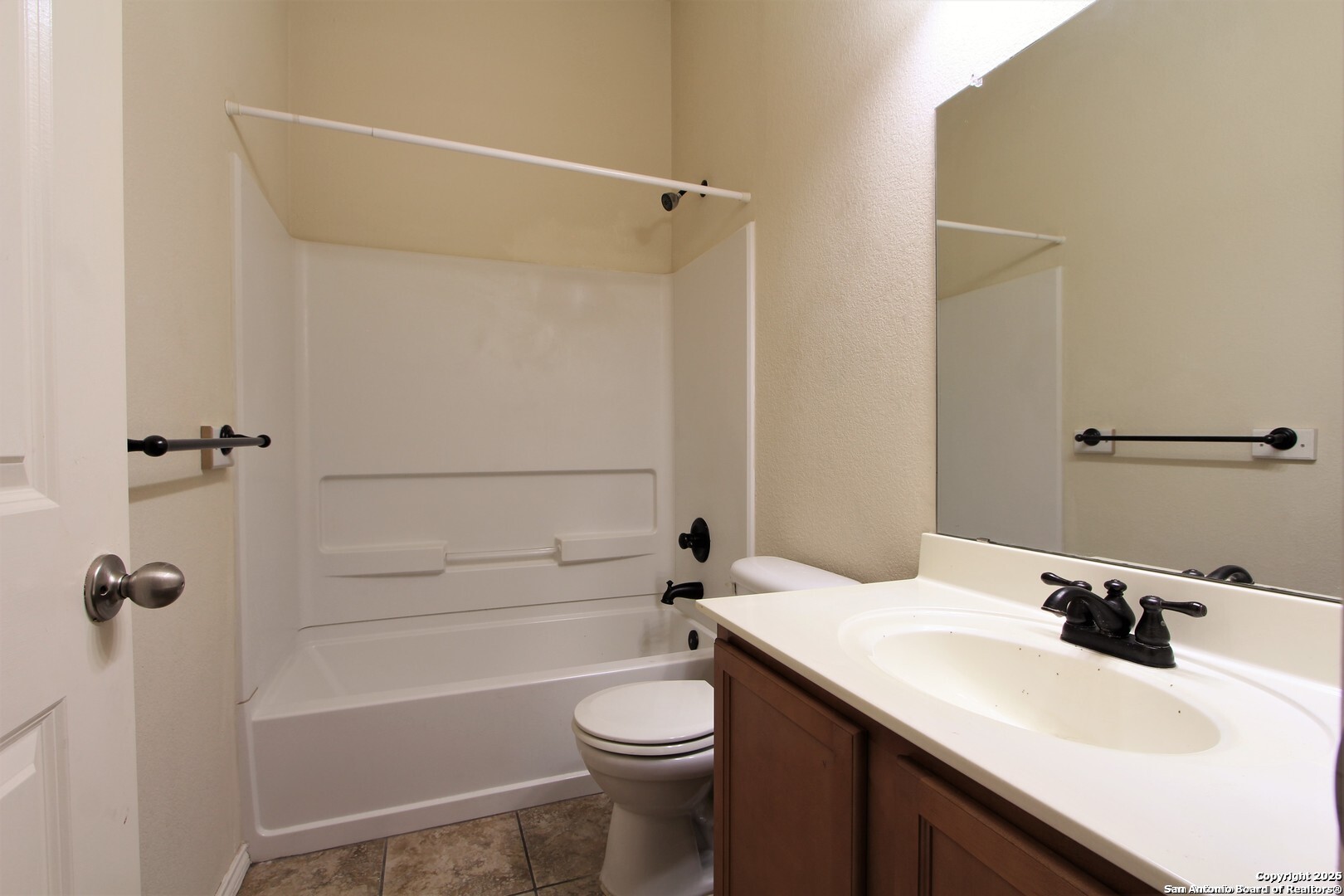 11118 Geneva Sound San Antonio, TX 78254 - Photo 6 of 15 a bathroom with a sink a toilet and shower