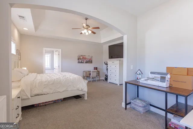 a white bath tub sitting next to a window