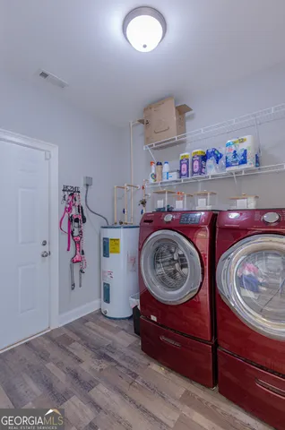 a view of a livingroom with furniture and a garage