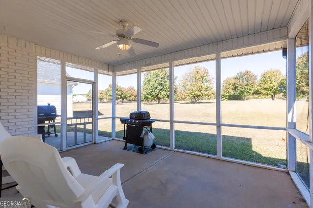 a house view with a swimming pool and a yard