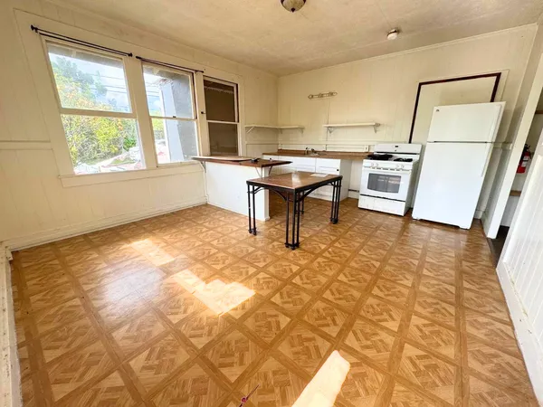a view of kitchen with furniture and window