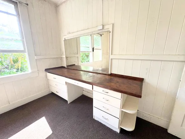 a room with a table and a window