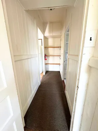 a view of a hallway view with staircase