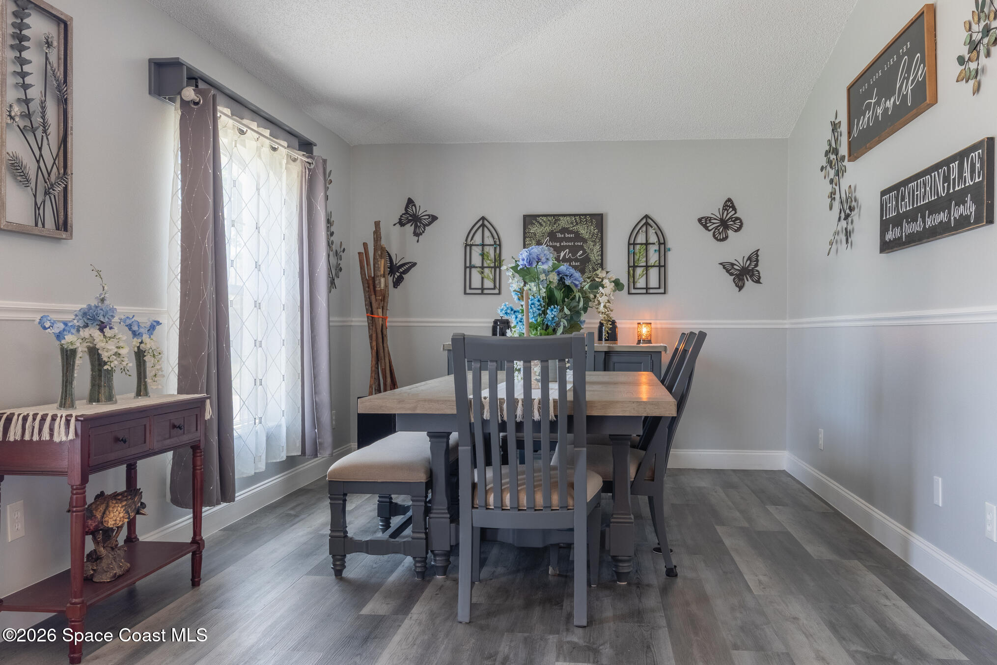 7210 Barbara Road Cocoa, FL 32927 - Photo 2 of 8 a view of a dining room with furniture wooden floor and a window