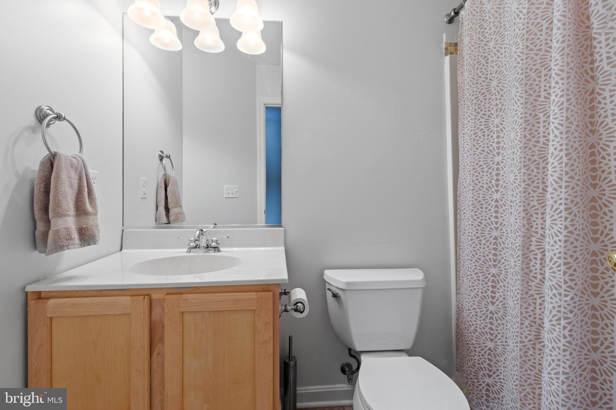 1615 Oldtown Road Edgewater, MD 21037 - Photo 14 of 35 a bathroom with a toilet sink and mirror