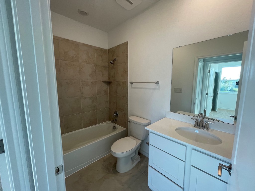 101 Thurman Holt Road Hutto, TX 78634 - Photo 14 of 38 a bathroom with a sink a toilet and shower