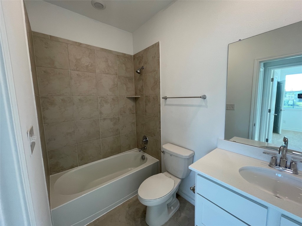 101 Thurman Holt Road Hutto, TX 78634 - Photo 15 of 38 a bathroom with a sink toilet and shower