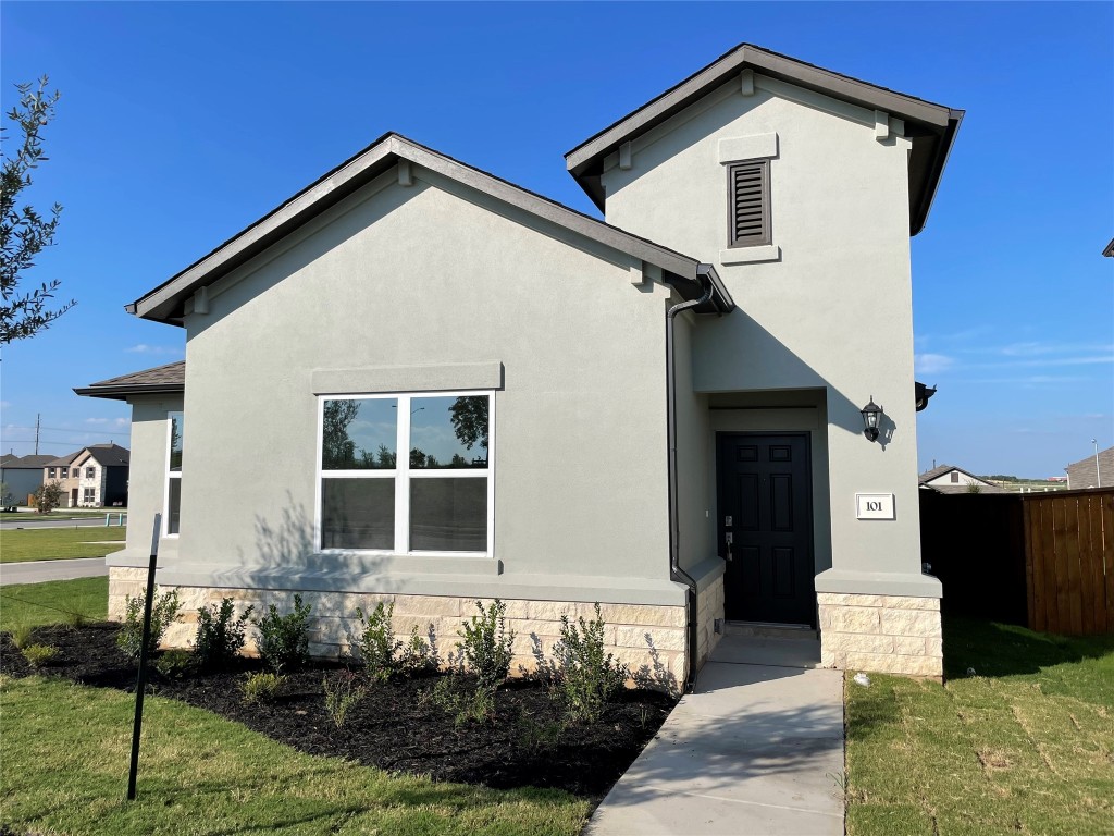 101 Thurman Holt Road Hutto, TX 78634 - Photo 2 of 38 a front view of a house with a yard