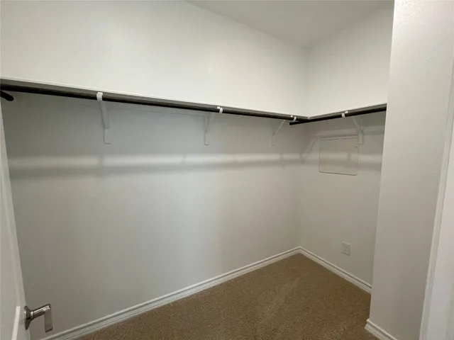 a kitchen with stainless steel appliances granite countertop a sink a stove and a wooden floors