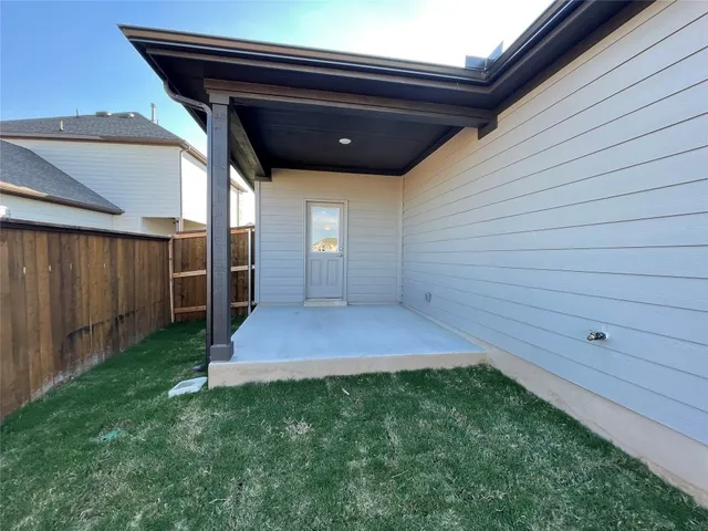 a view of front door and yard