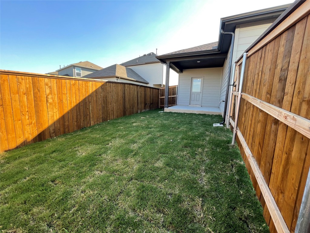 101 Thurman Holt Road Hutto, TX 78634 - Photo 35 of 38 a view of a backyard with pathway