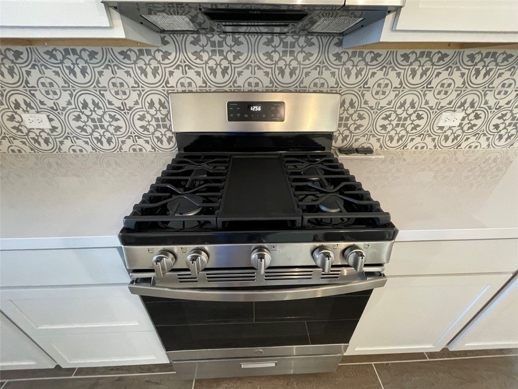 101 Thurman Holt Road Hutto, TX 78634 - Photo 38 of 38 a stove top oven sitting inside of a kitchen