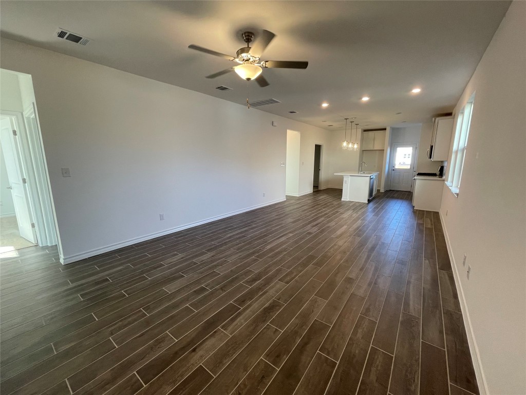 101 Thurman Holt Road Hutto, TX 78634 - Photo 6 of 38 a view of a livingroom with wooden floor