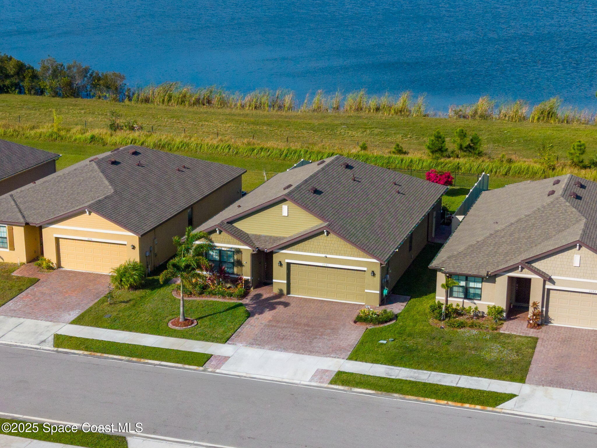 2083 Farmhouse Road Southeast Palm Bay, FL 32909 - Photo 2 of 41 1-web-or-mls-Drone-1