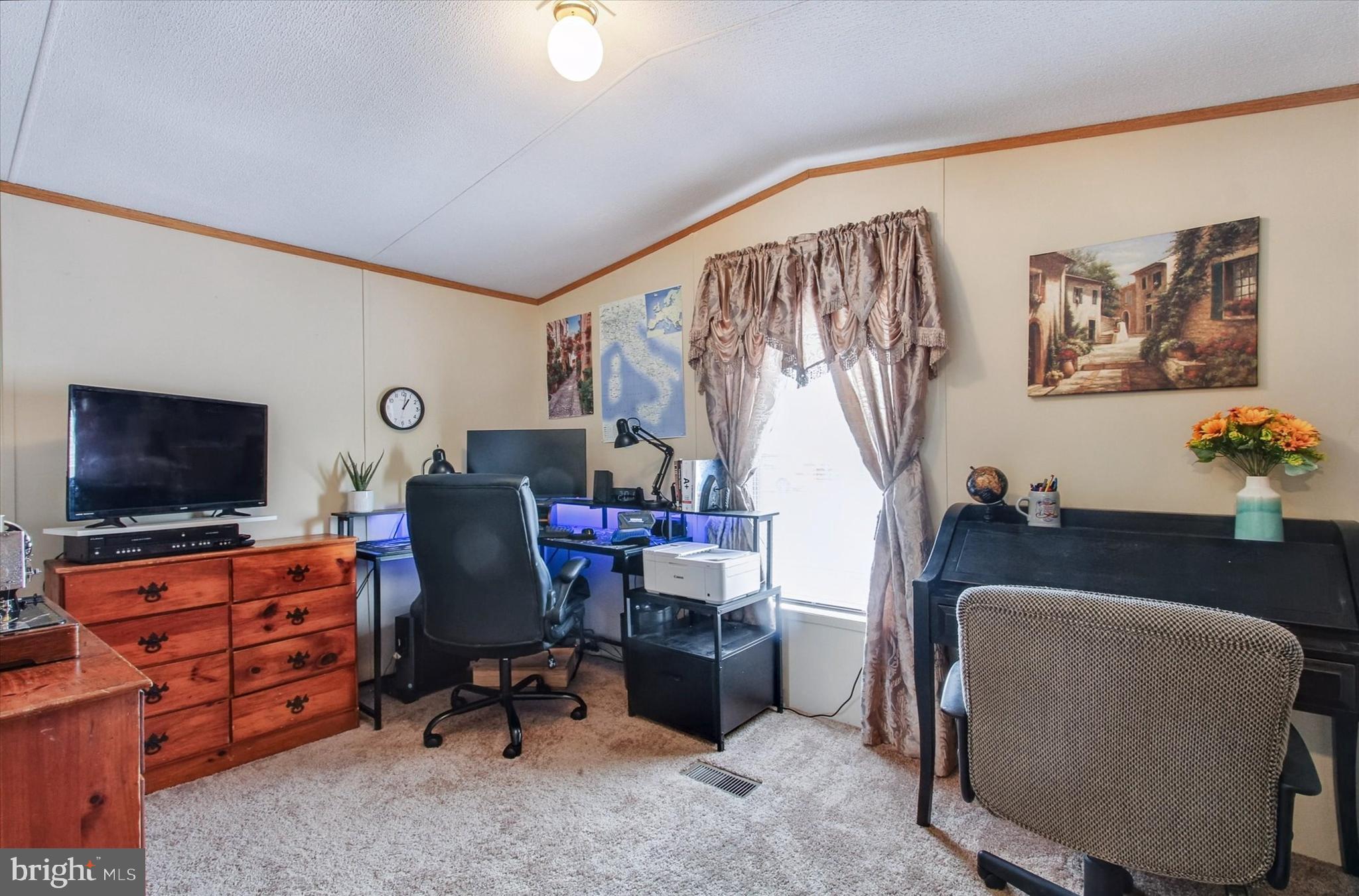 2215 Biglerville Road, Unit 15 Gettysburg, PA 17325 - Photo 18 of 21 a workspace with furniture and a flat screen tv
