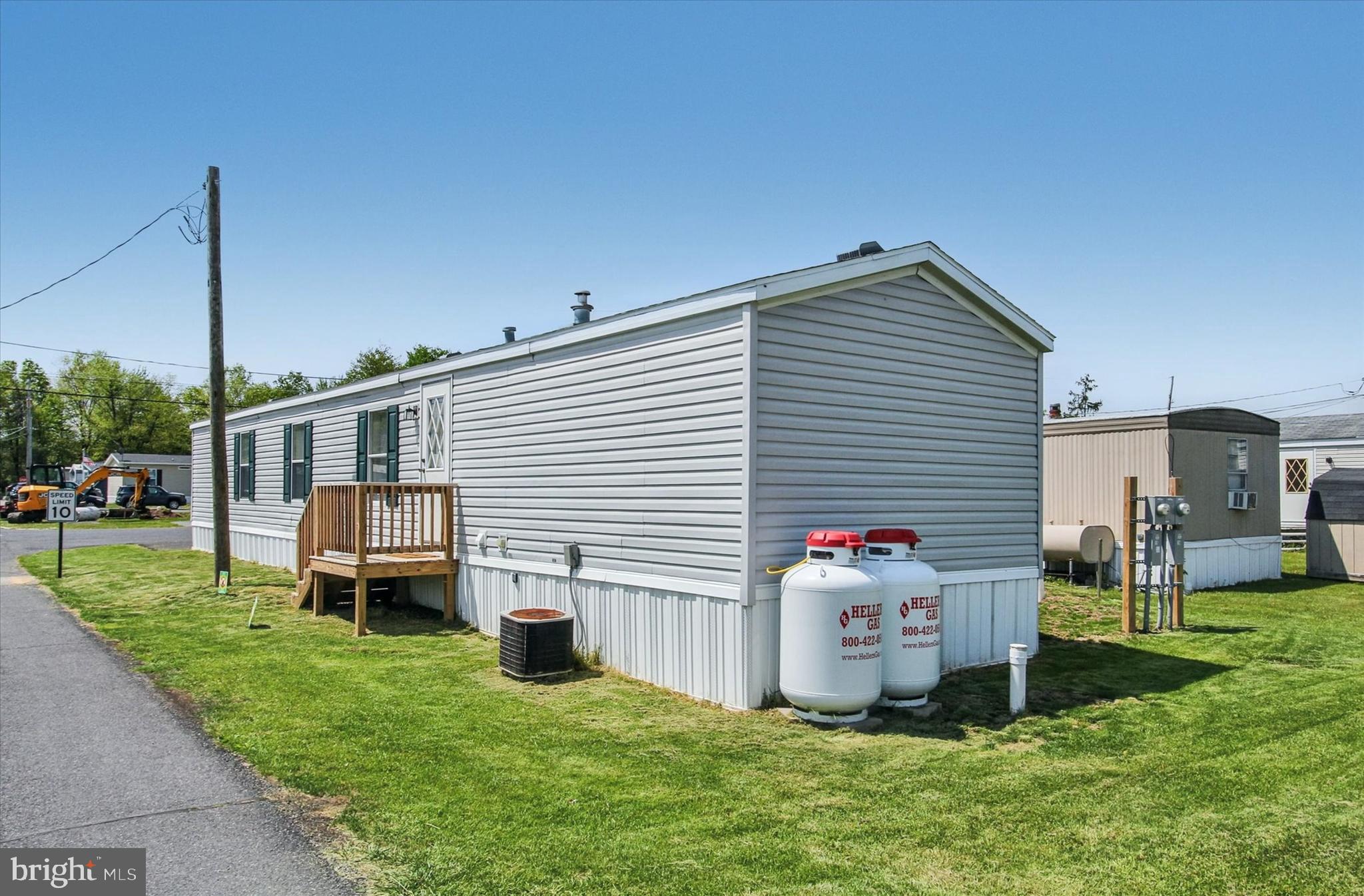2215 Biglerville Road, Unit 15 Gettysburg, PA 17325 - Photo 2 of 21 a house view with a sitting space and garden