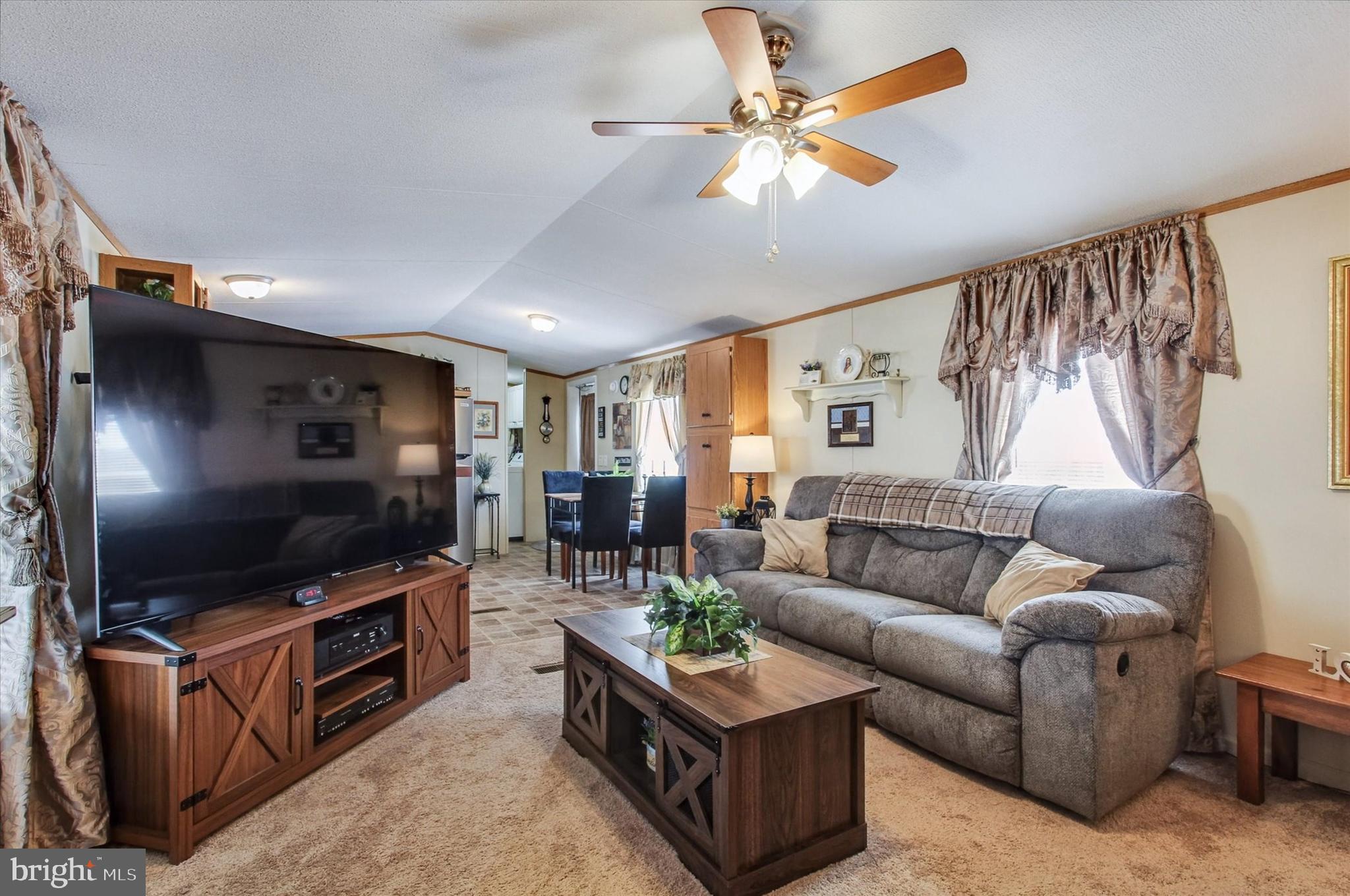 2215 Biglerville Road, Unit 15 Gettysburg, PA 17325 - Photo 7 of 21 a living room with furniture and a flat screen tv