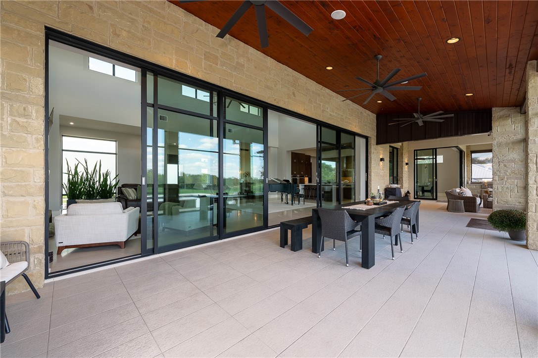 3320 Sycamore Trail Bryan, TX 77807 - Photo 26 of 48 View of patio featuring a ceiling fan and outdoor dining area