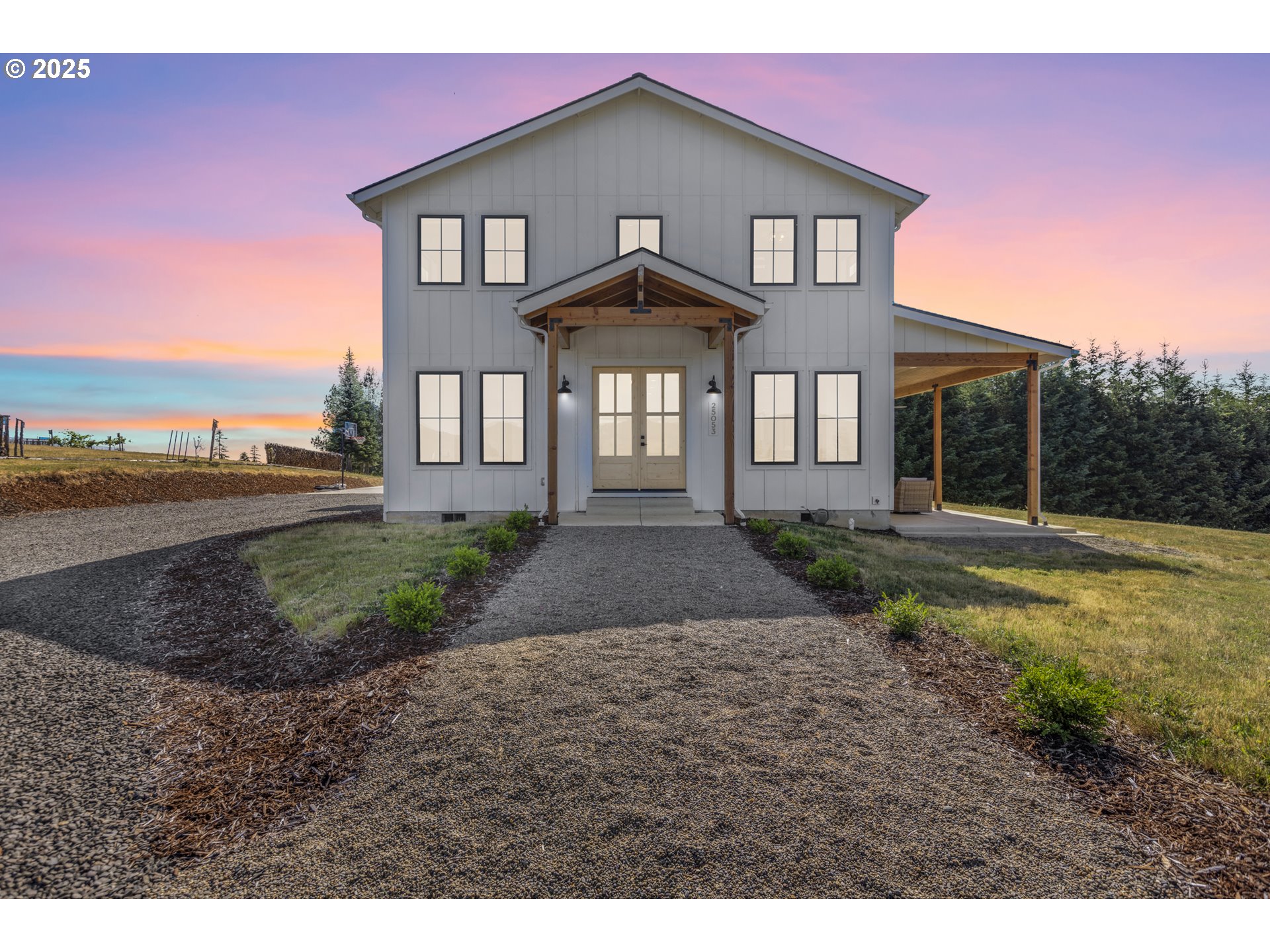 25053 Larson Road Monroe, OR 97456 - Photo 1 of 45 a front view of a house with a yard and garage