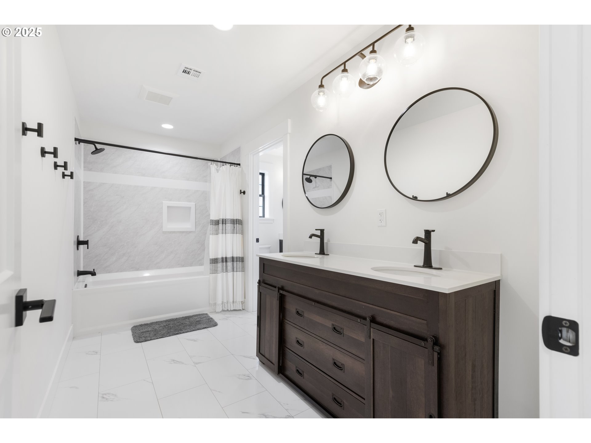 25053 Larson Road Monroe, OR 97456 - Photo 29 of 45 a bathroom with a double vanity sink mirror and shower