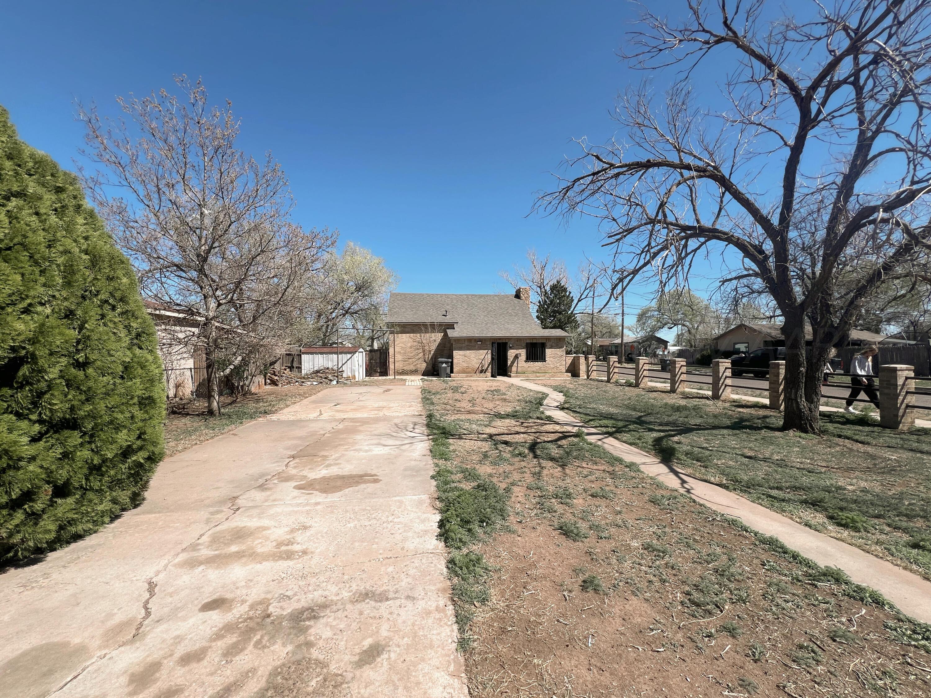 3811 South Polk Street Amarillo, TX 79110 - Photo 3 of 27 a view of a yard with a house