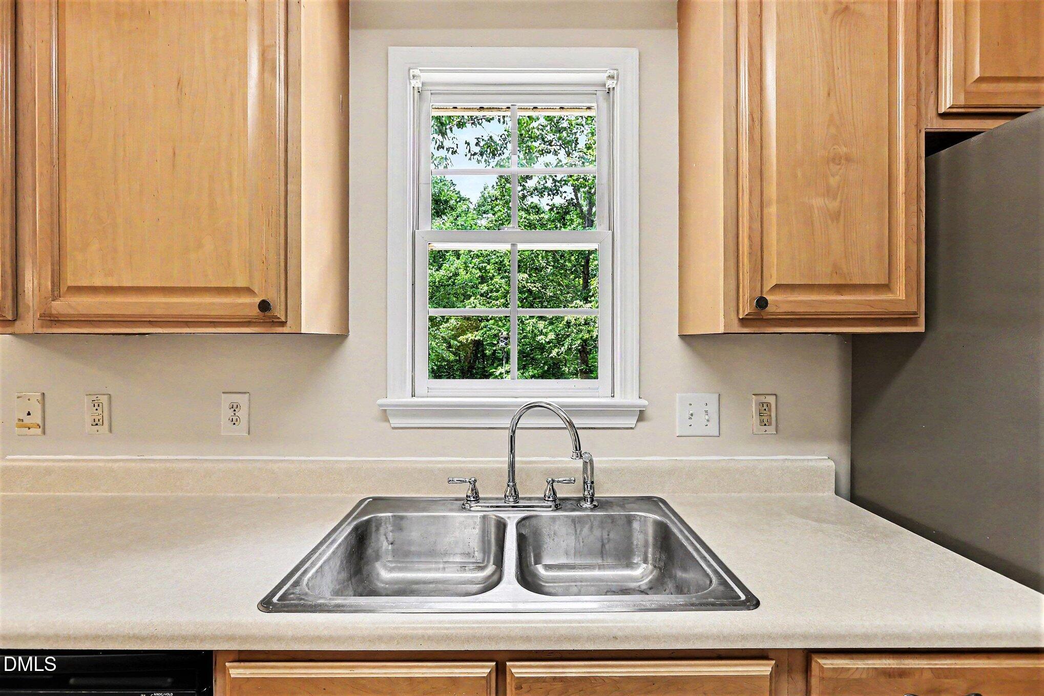 5359 Bass Mountain Road Snow Camp, NC 27349 - Photo 7 of 25 a kitchen with granite countertop a sink and a window