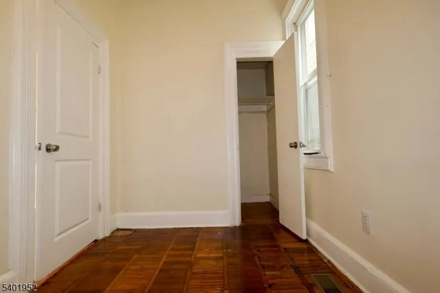 a view of a bathroom with wooden floor
