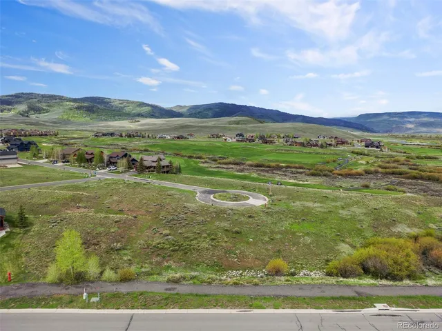 a view of a field with an ocean