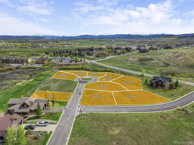 a view of a swimming pool with a lake and mountain view