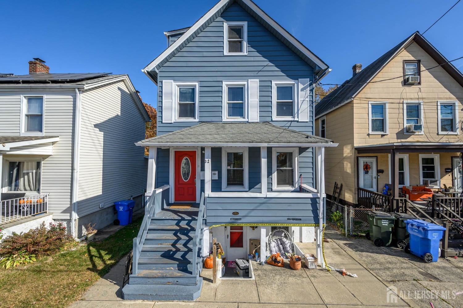32 Lee Street Port Reading, NJ 07064 - Photo 1 of 32 a front view of a house with garden
