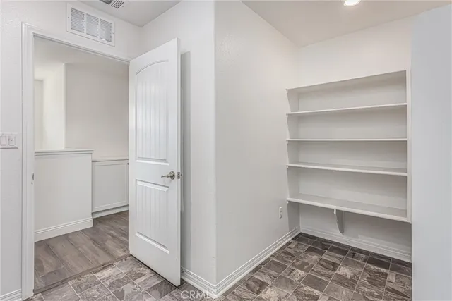 a balcony with table and chairs