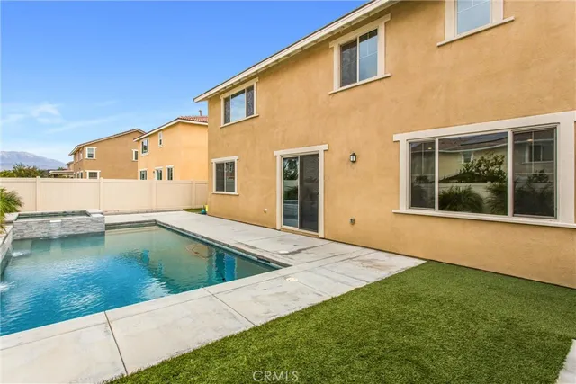 a view of a swimming pool with an outdoor seating