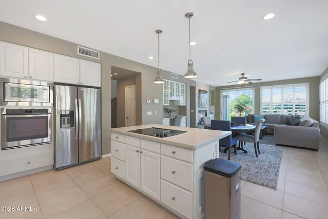 a spacious bathroom with a shower sink and mirror