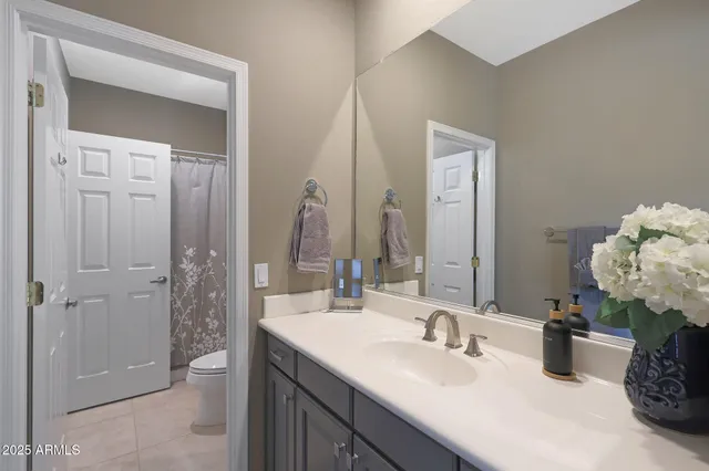 a bathroom with a double vanity sink mirror and double