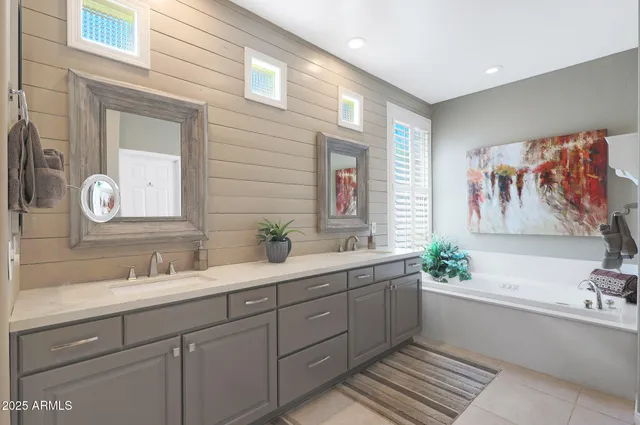 a dining room with furniture and a large window