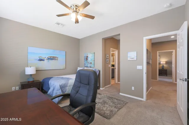 a bedroom with a workspace