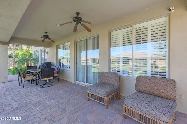 a view of a house with a yard patio and swimming pool