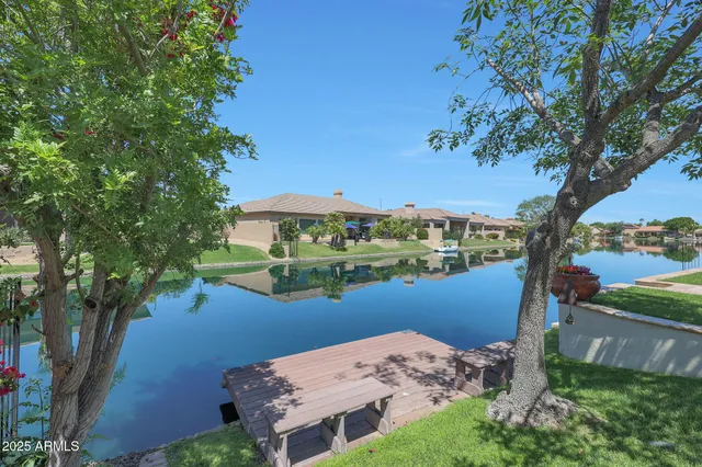 a couple of chairs sitting in front of a house