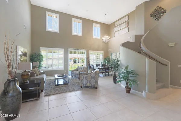 a kitchen with stainless steel appliances granite countertop white cabinets a sink stove and refrigerator