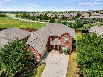 an aerial view of a house with a garden