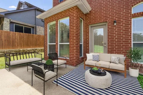 a balcony with furniture and a potted plant