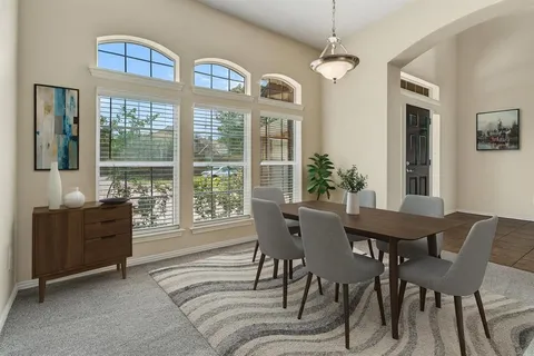a view of a dining room with furniture window and outside view
