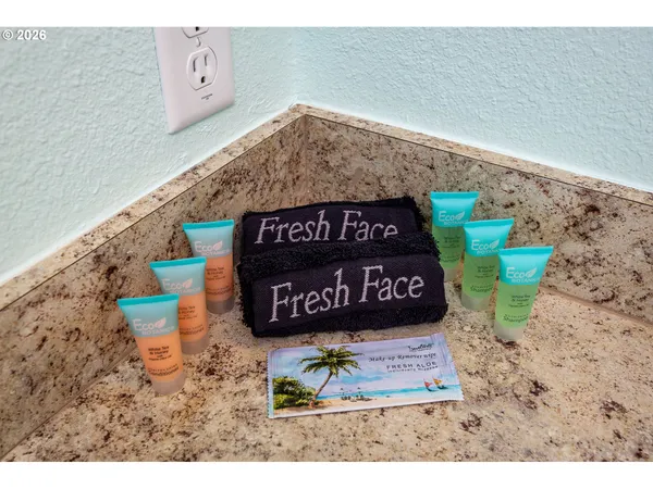 a sign that is sitting on a brick wall