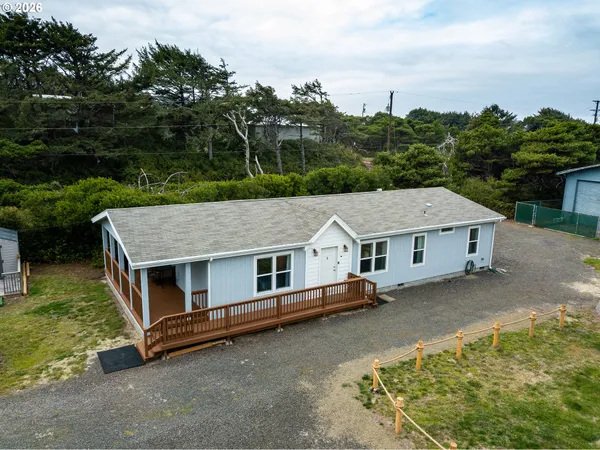 an aerial view of a house with roof deck front of house